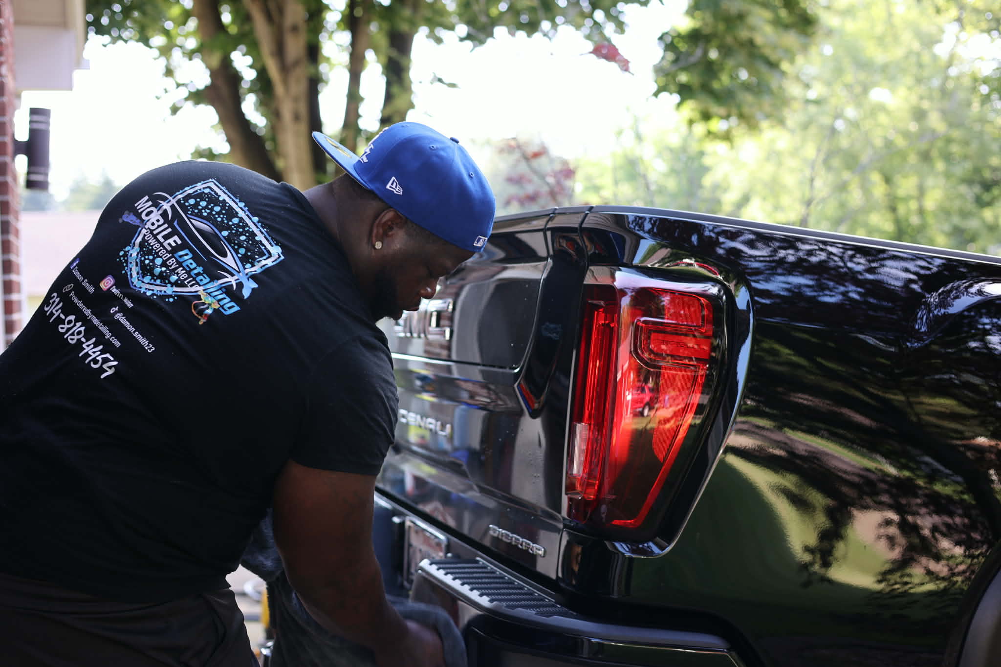 Damon Smith polishing a door panel